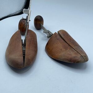 Antique wooden shoe trees adjustable metal springs to maintain shoe shape.